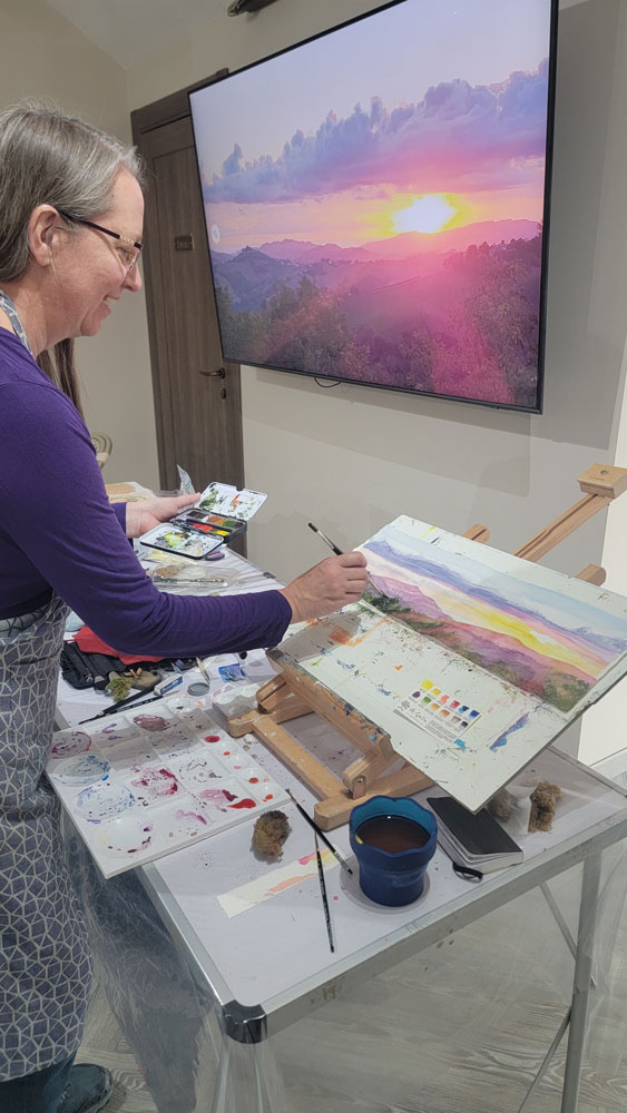 Julie Painting sunrise in Montelparo, Italy