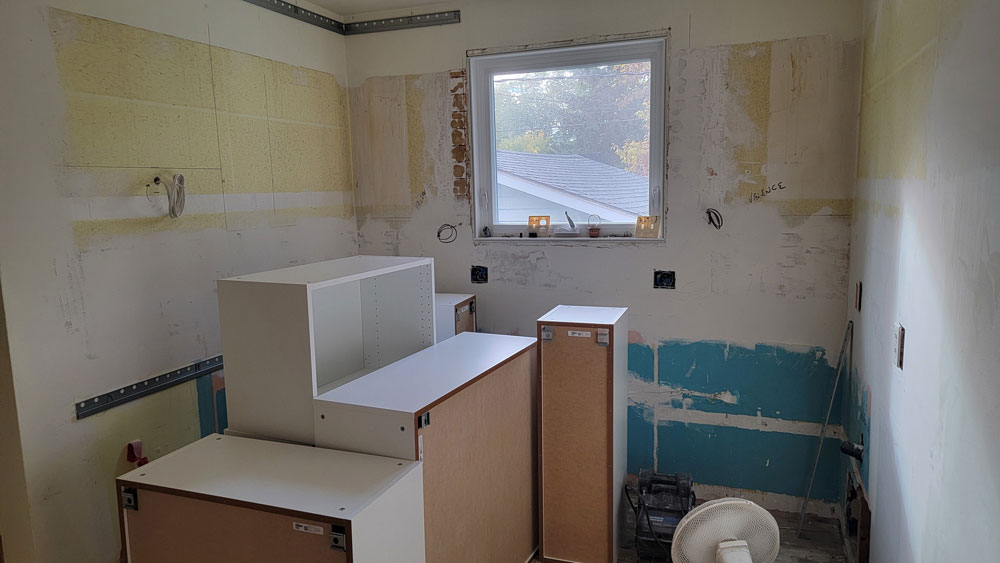 demolition of kitchen and the new cupboards being built